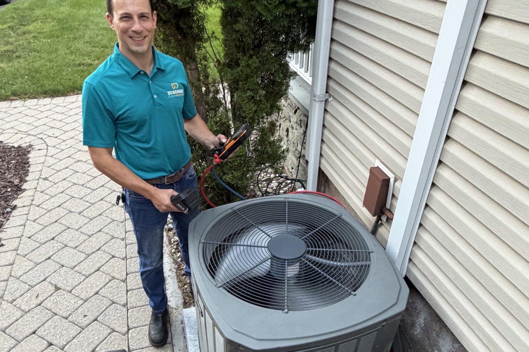 3Degrees technician installing an air conditioning condenser